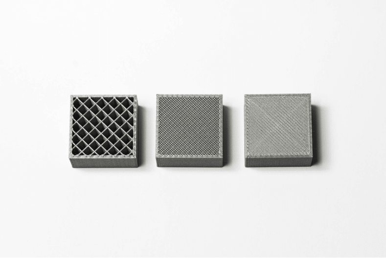 Three grey boxes on a white surface.