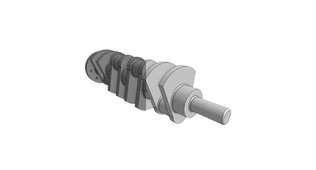 Split crankshaft showing carbon on one side and alloy on the other, highlighting material contrast.