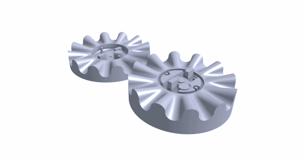 Two white interlocking bevel gears with angled teeth, positioned on a white background—ideal for showcasing prototyping injection moldings in mechanical design.
