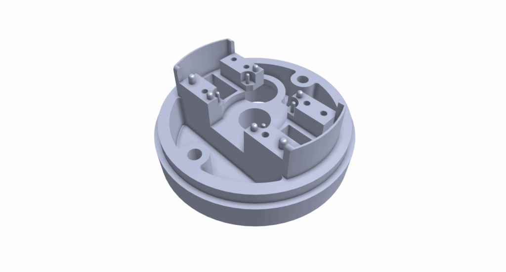3D-rendered image of a round, gray mechanical component with multiple slots, holes, and raised sections, ideal for prototyping injection moldings, viewed from an angle against a white background.