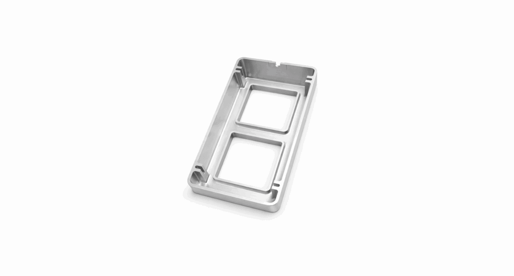 Rectangular metal tray with two large square cutouts, beveled edges, and precision resembling cnc plastic machining, placed on a white background.