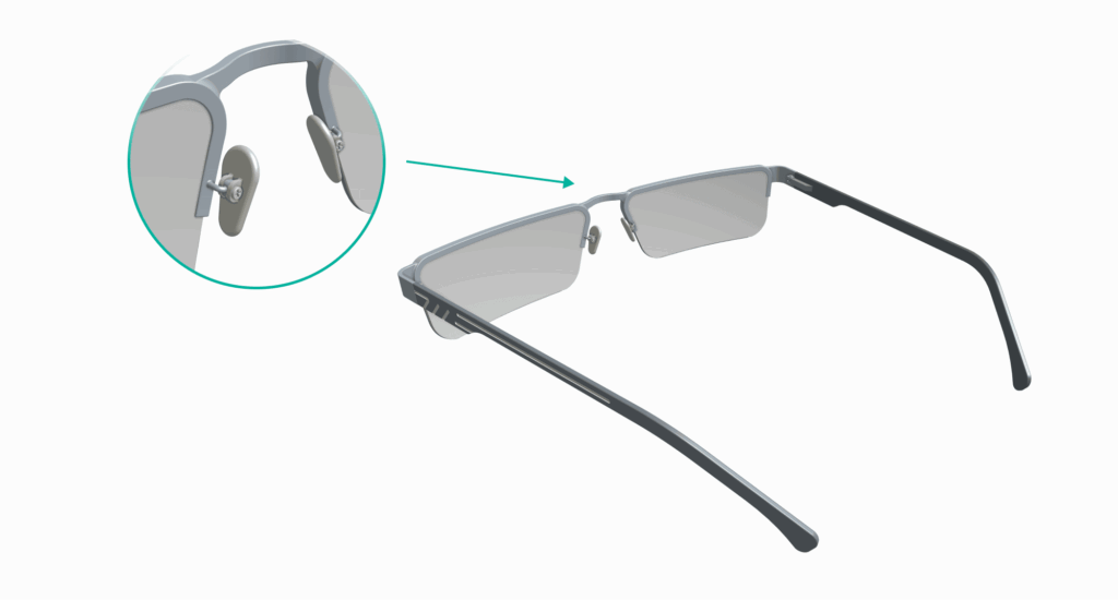 A pair of eyeglasses with a close-up inset showing the nose pad detail and spot welding, highlighted by an arrow.