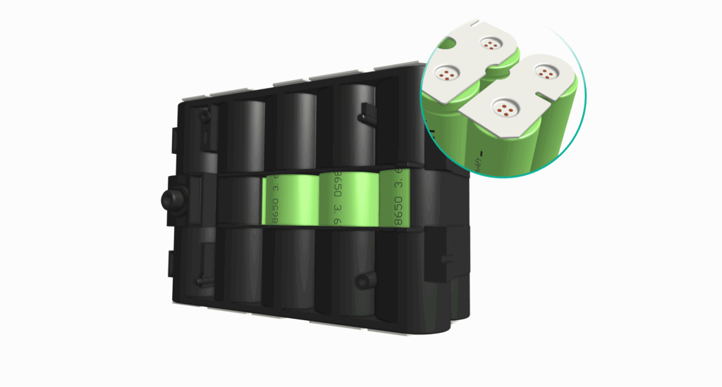 Black plastic battery pack case with visible green cylindrical batteries inside; inset circle shows a close-up of the battery terminals, highlighting neat spot welding on the connections.