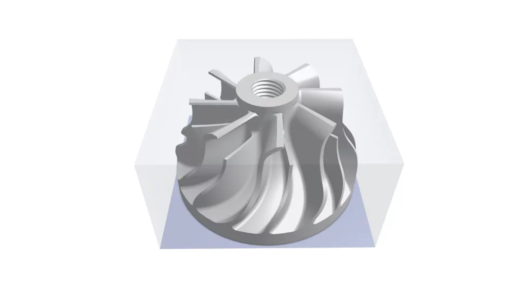 Raw titanium block with the target impeller geometry overlaid, illustrating material volume to be removed.