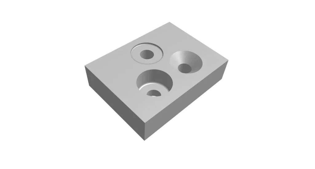 3D machined metal block with circular recesses and counterbored holes illustrating engineering drawing hole symbols and manufacturing feature callouts.