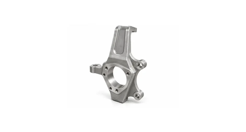 CNC-machined aluminum steering knuckle with clean, burr-free hole edges, bore, and outer contours after deburring